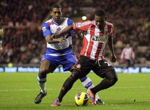 Sunderland's Beninese midfielder Stephane Sessegnon (R) vies with Reading's Mikele Leigertwood (L)