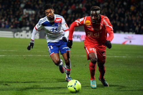 Lyon's Brazilian midfielder Michel Bastos (L) vies with Nancy's French defender Massadio Haidara