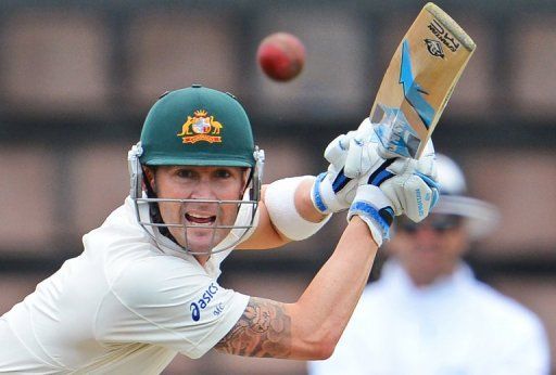 Michael Clarke drives a ball from the Sri Lankan bowling in the first Test in Hobart on December 14, 2012