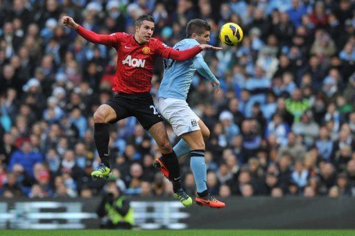 City&#039;s defender Matija Nastasic (right) vies with United&#039;s striker Robin Van Persie in Manchester, December 9, 2012