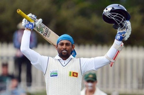 Sri Lanka's Tillakaratne Dilshan celebrates after scoring a century in the first Hobart Test on December 16, 2012