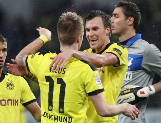 Kevin Grosskreutz (right) celebrates scoring the 2-1 with striker Marco Reus on December 16, 2012