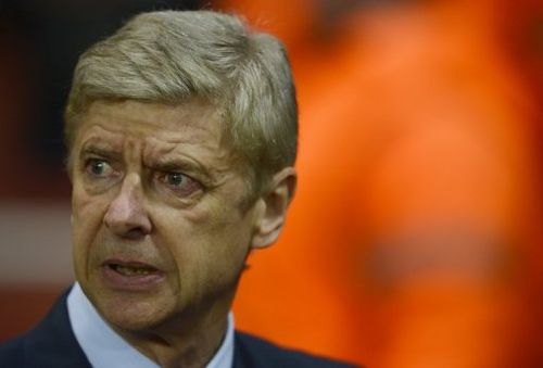 Arsenal's French manager Arsene Wenger takes his seat before a UEFA Champions League match on November 21, 2012