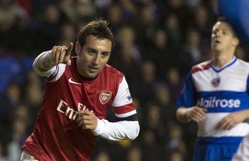 Arsenal's Spanish midfielder Santi Cazorla (R) celebrates scoring his third goal against Reading