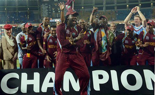 West Indies cricketer Chris Gayle (C) celebrates his team&#039;s victory in Colombo on October 7, 2012