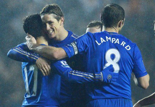 Fernando Torres (2nd left) hugs Eden Hazard as Chelsea score their 5th against Leeds at Elland Road on December 19, 2012