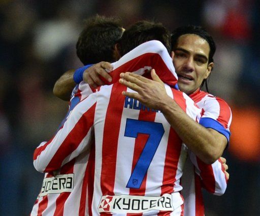 Atletico Madrid players celebrate their 1-0 victory over Celta de Vigo, in Madrid, on December 21, 2012