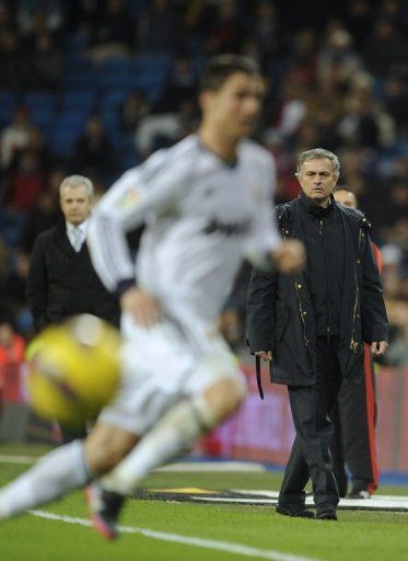 Real Madrid&#039;s coach Jose Mourinho (R), pictured during their match against Espanyol, in Madrid, on December 16, 2012