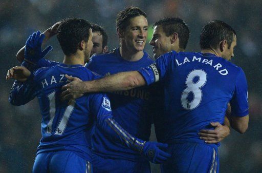 Chelsea forward Fernando Torres (3rd R) celebrates after scoring during a League Cup match on December 19, 2012