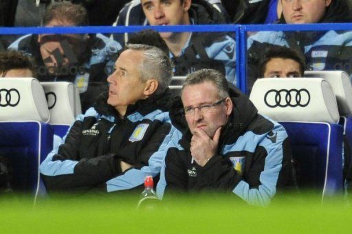 Aston Villa&#039;s manager Paul Lambert (R) reacts during the match between Chelsea and Villa on December 23, 2012