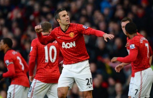 Robin van Persie celebrates scoring the first goal against Sunderland at Old Trafford on December 15, 2012