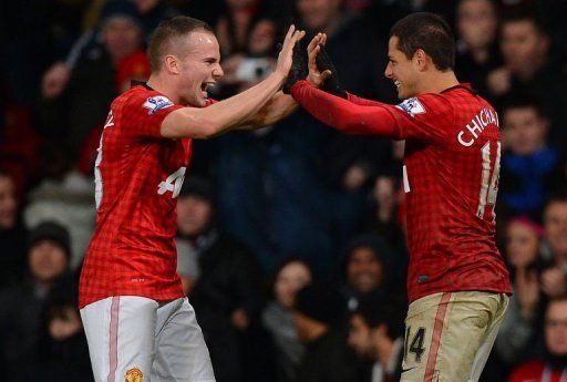 Tom Cleverley (L) celebrates with Javier Hernandez at Old Trafford on December 26, 2012