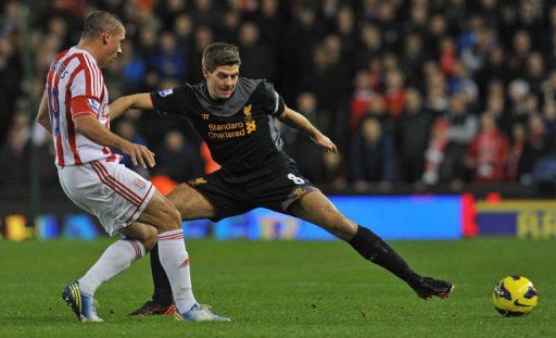 Liverpool&#039;s Steven Gerrard (R) vies with Stoke City&#039;s Jonathan Walters (L) in Stoke-on-Trent on December 26, 2012