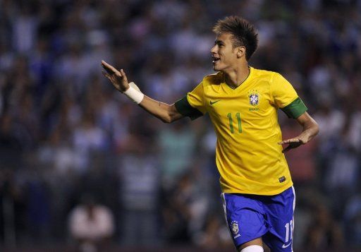 Neymar celebrates after scoring a penalty kick at La Bombonera stadium in Buenos Aires on November 21, 2012