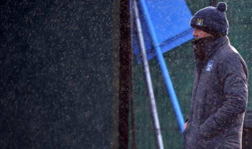 Manchester City manager Roberto Mancini looks on during a training session in Manchester on December 3, 2012