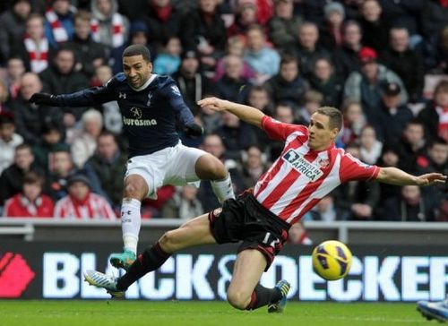 Sunderland's Matthew Kilgallon (R) tackles Tottenham's Aaron Lennon at The Stadium of Light on December 29, 2012