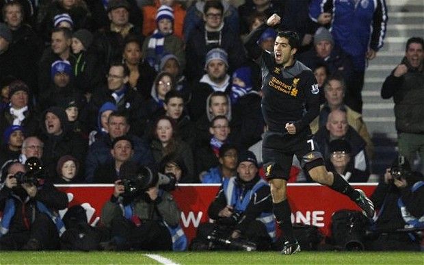 Luis Suarez celebrating his first goal against QPR.