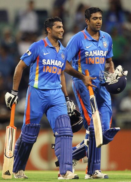 Indian batsmen Ravindra Jadeja (L) and R