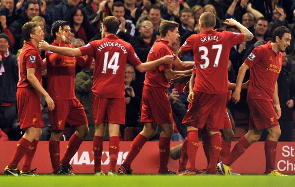 Liverpool&#039;s Uruguayan striker Luis Suarez (2nd L) celebrates scoring their third goal with teammates during the English Premier League football match between Liverpool and Sunderland at Anfield in Liverpool, north-west England on January 2, 2013. Liverpool won the game 3-0. AFP PHOTO/PAUL ELLISRESTRICTED TO EDITORIAL USE. No use with unauthorized audio, video, data, fixture lists, club/league logos or ?live? services. Online in-match use limited to 45 images, no video emulation. No use in betting, games or single club/league/player publications.   