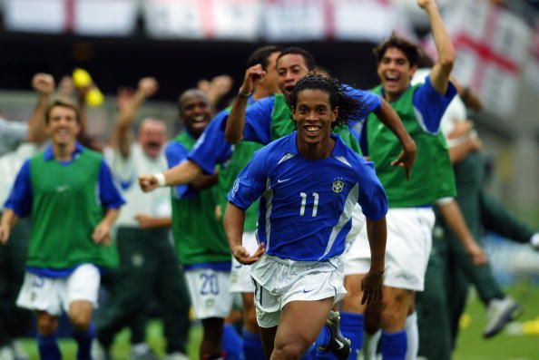 SHIZUOKA - JUNE 21:  Ronaldinho of Brazil celebrates scoring the winning goal during the FIFA World Cup Finals 2002 Quarter Finals match between England and Brazil played at the Shizuoka Stadium Ecopa