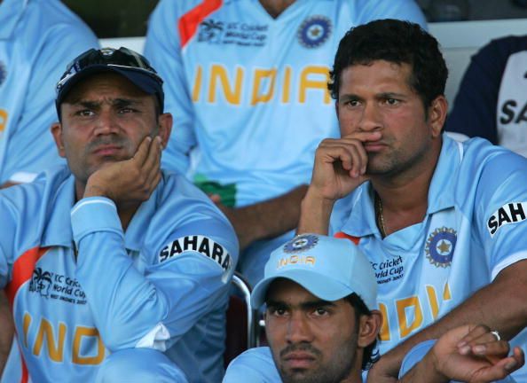 Indian cricketer Virender Sehwag (L) and