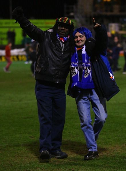 OLDHAM, ENGLAND - JANUARY 27:  Oldham fans celebrate victory at the end of the FA Cup with Budweiser Fourth Round match between Oldham Athletic and Liverpool 