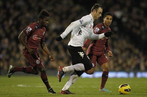 File picture shows Fulham striker Dimitar Berbatov (C) at Craven Cottage in west London on December 10, 2012