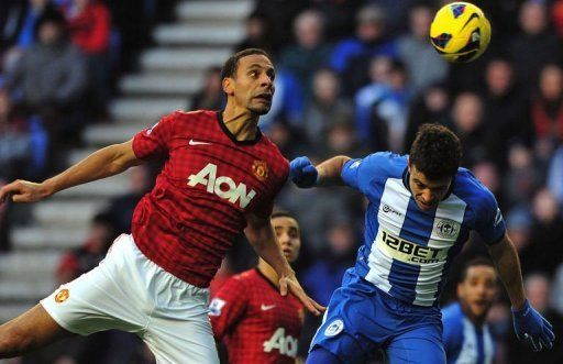 United&#039;s Rio Ferdinand (L) vies with Wigan&#039;s Franco Di Santo (R) in Wigan on January 1, 2013