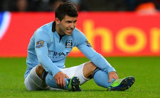 Manchester City&#039;s Sergio Aguero reacts after picking up an injury in Manchester on January 1, 2013