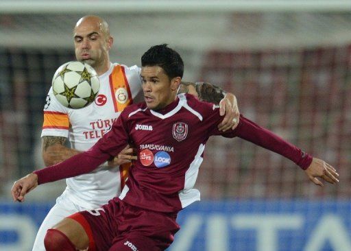 Galatasaray&#039;s defender Cris (left) and Cluj&#039;s midfielder Rafael Bastos in Cluj-Napoca, Romania on November 7, 2012