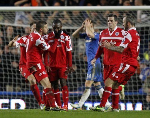 Shaun Wright-Phillips (3rd L) celebrates scoring the only goal of the game for QPR against Chelsea on January 2, 2013