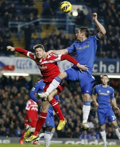 Queens Park Rangers striker Jamie Mackie (L) battles with Frank Lampard at Stamford Bridge on January 2, 2013