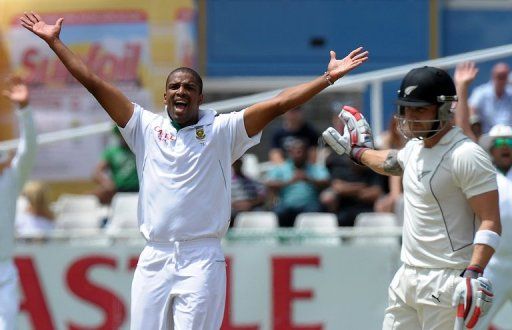 South Africa&#039;s bowler Vernon Philander (left)  at Newlands on January 3, 2013 in Cape Town.