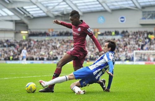 Newcastle United's Sammy Ameobi (left) and Brighton & Hove Albion's David Lopez in Brighton, England on January 5, 2013