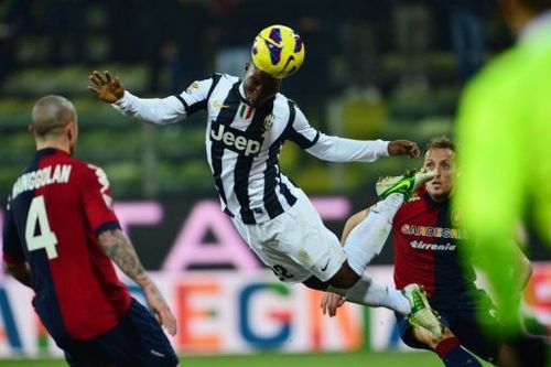 Juventus' Kwadwo Asamoah heads the ball  during their match against Cagliari, in Parma, on December 21, 2012