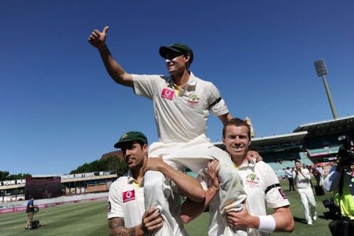 Peter Siddle (R) and Mitchell Johnson carry Australian teammate Mike Hussey off the field on January 6, 2013