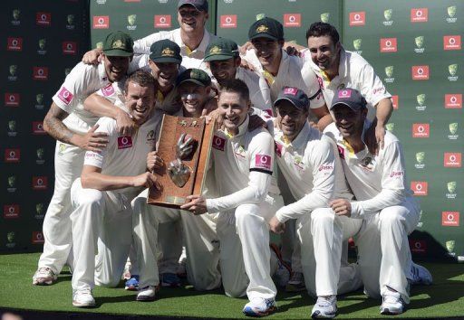 Australia pose with the trophy after defeating Sri Lanka in the third Test at Sydney Cricket Ground on January 6, 2013