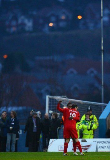 Liverpool&#039;s Daniel Sturridge (back) celebrates with Stewart Downing after scoring against Mansfield on January 6, 2013