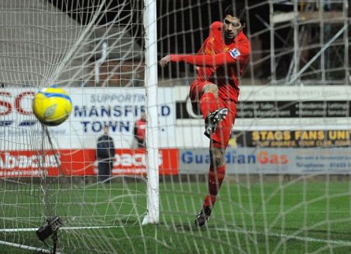 Liverpool's Luis Suarez scores in Mansfield, central England, on January 6, 2013