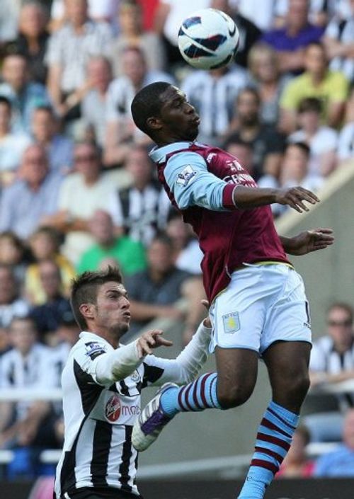 Newcastle's Davide Santon (L) challenges Aston Villa's Charles N' Zogbia on September 2, 2012