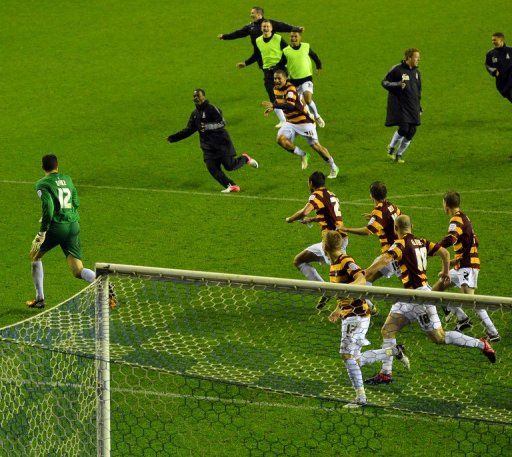 Bradford City celebrate winning the penalty shoot-out against Wigan in the League Cup fourth round on October 30, 2012