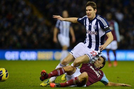 West Bromwich Albion midfielder Zoltan Gera is tackled by West Ham midfielder Mark Noble on December 16, 2012