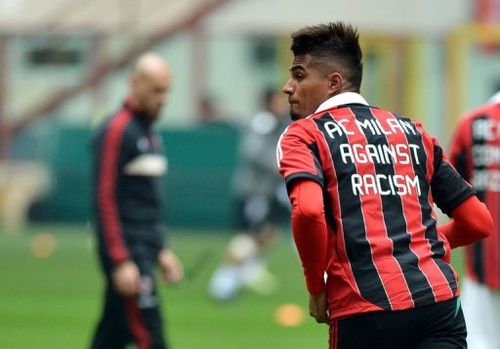 AC Milan's defender Kevin-Prince Boateng warms up wearing a jersey against the racism on January 6, 2013, in Milan