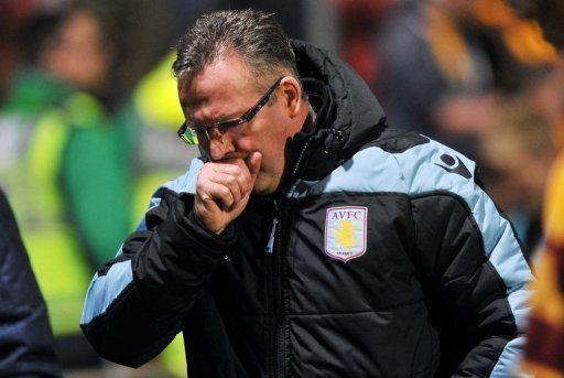 Aston Villa manager Paul Lambert cuts a pensive figure at half time of his side&#039;s loss at Bradford on January 8, 2013