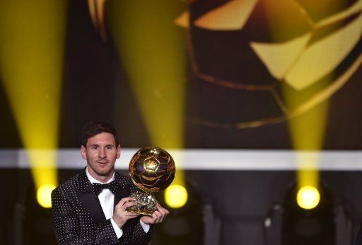 Lionel Messi poses with the Ballon d&#039;Or trophy at the awards ceremony at the Kongresshaus in Zurich on January 7, 2013