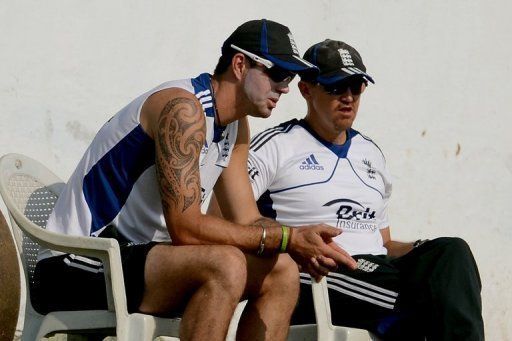 England cricketer Kevin Pietersen (L) with coach Andy Flower in Ahmedabad, western India, on November 9, 2012