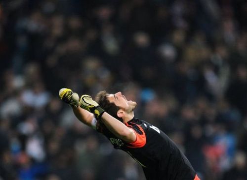 Real Madrid's goalkeeper and captain Iker Casillas celebrates his team's score on January 9, 2012