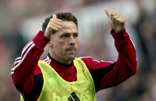 Stoke City&#039;s Michael Owen gestures to the fans at the Brittania Stadium in Stoke on September 15, 2012