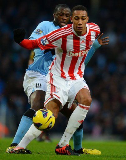 Stoke City&#039;s Steven N&#039;Zonzi (R) fights for the ball with Manchester City&#039;s Yaya Toure, in Manchester, on January 1, 2013