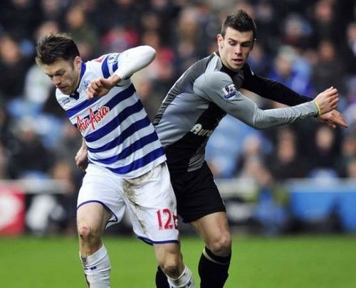 QPR's Jamie Mackie (L) clashes with Tottenham's Gareth Bale during their English Premier League match, January 12, 2013